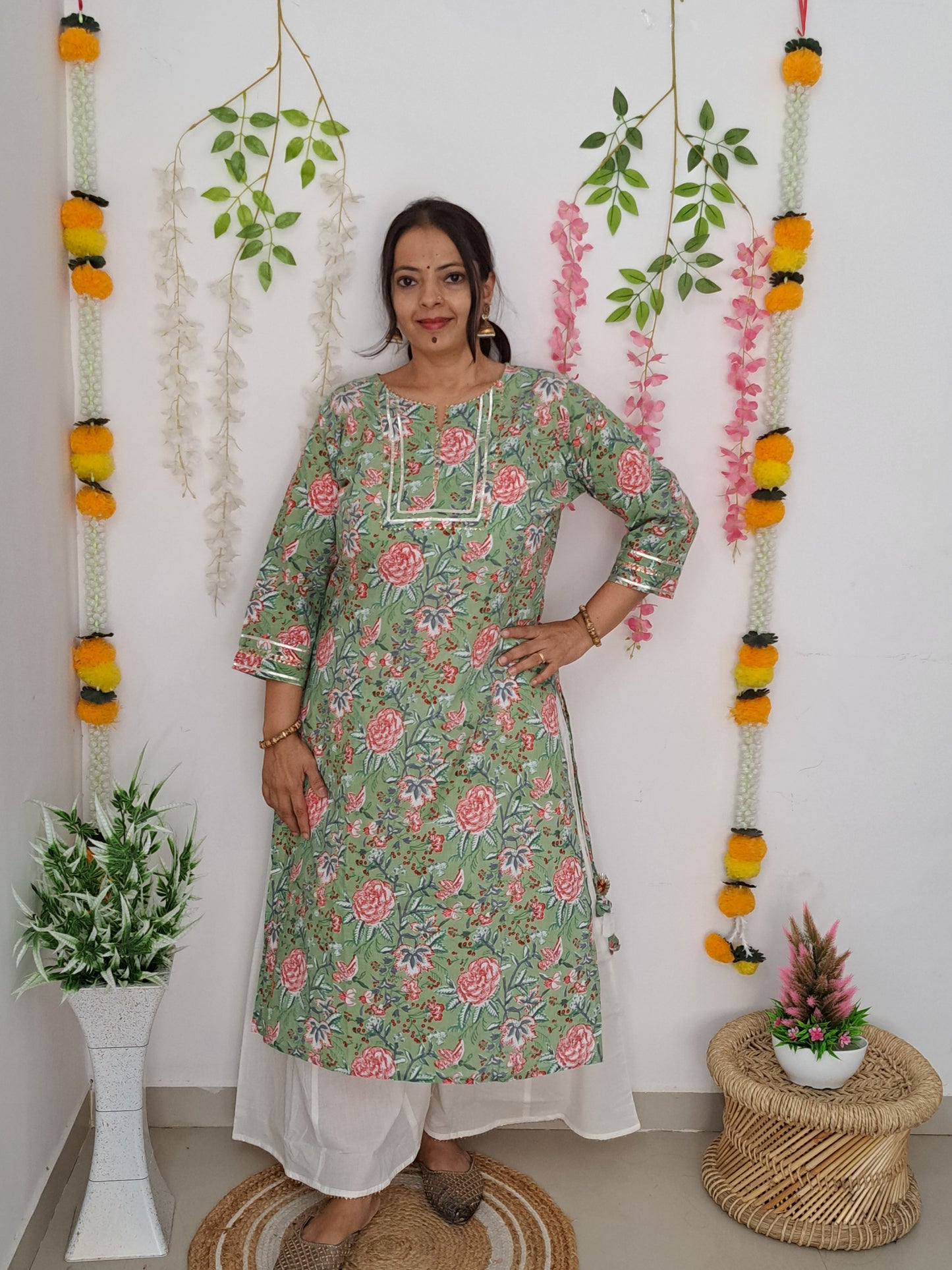 Floral Elegance: Pista Green Floral Cotton Kurta palazzo set with Gota Patti Work